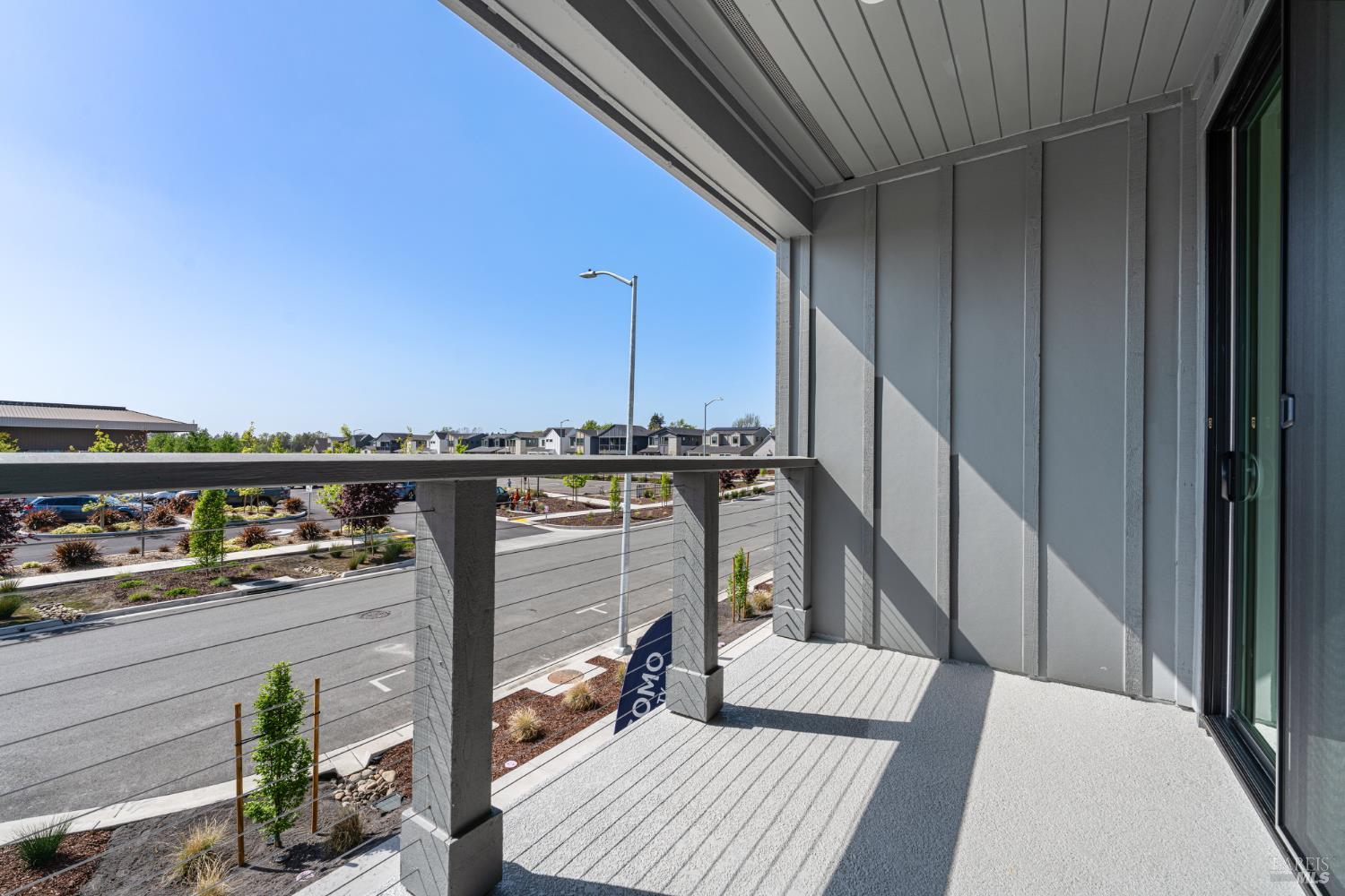 1480 Waterside Lane Rohnert Park, CA 94928 - Photo 33 of 35 a view of a balcony with two chairs and a barbeque