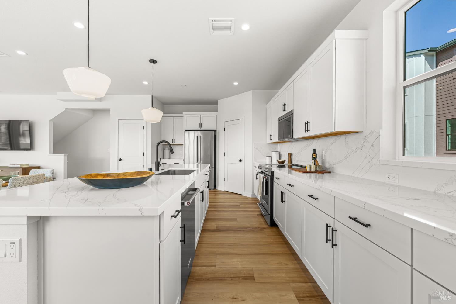 1480 Waterside Lane Rohnert Park, CA 94928 - Photo 5 of 35 a kitchen with stainless steel appliances a sink a stove a refrigerator and cabinets