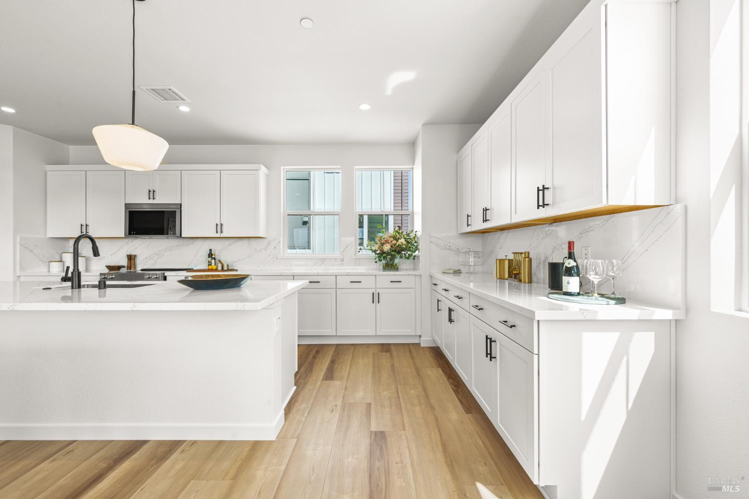 1480 Waterside Lane Rohnert Park, CA 94928 - Photo 6 of 35 a kitchen with kitchen island granite countertop a sink appliances cabinets and a counter top space