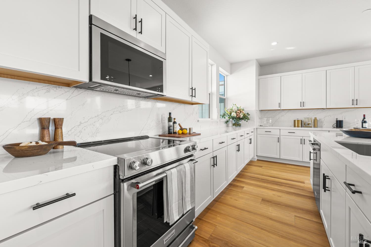1480 Waterside Lane Rohnert Park, CA 94928 - Photo 7 of 35 a kitchen with a sink stove and microwave