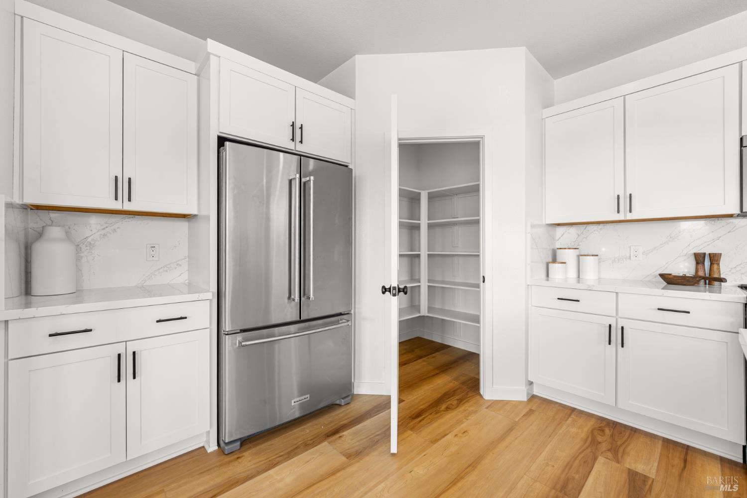 1480 Waterside Lane Rohnert Park, CA 94928 - Photo 8 of 35 a kitchen with white cabinets and white appliances
