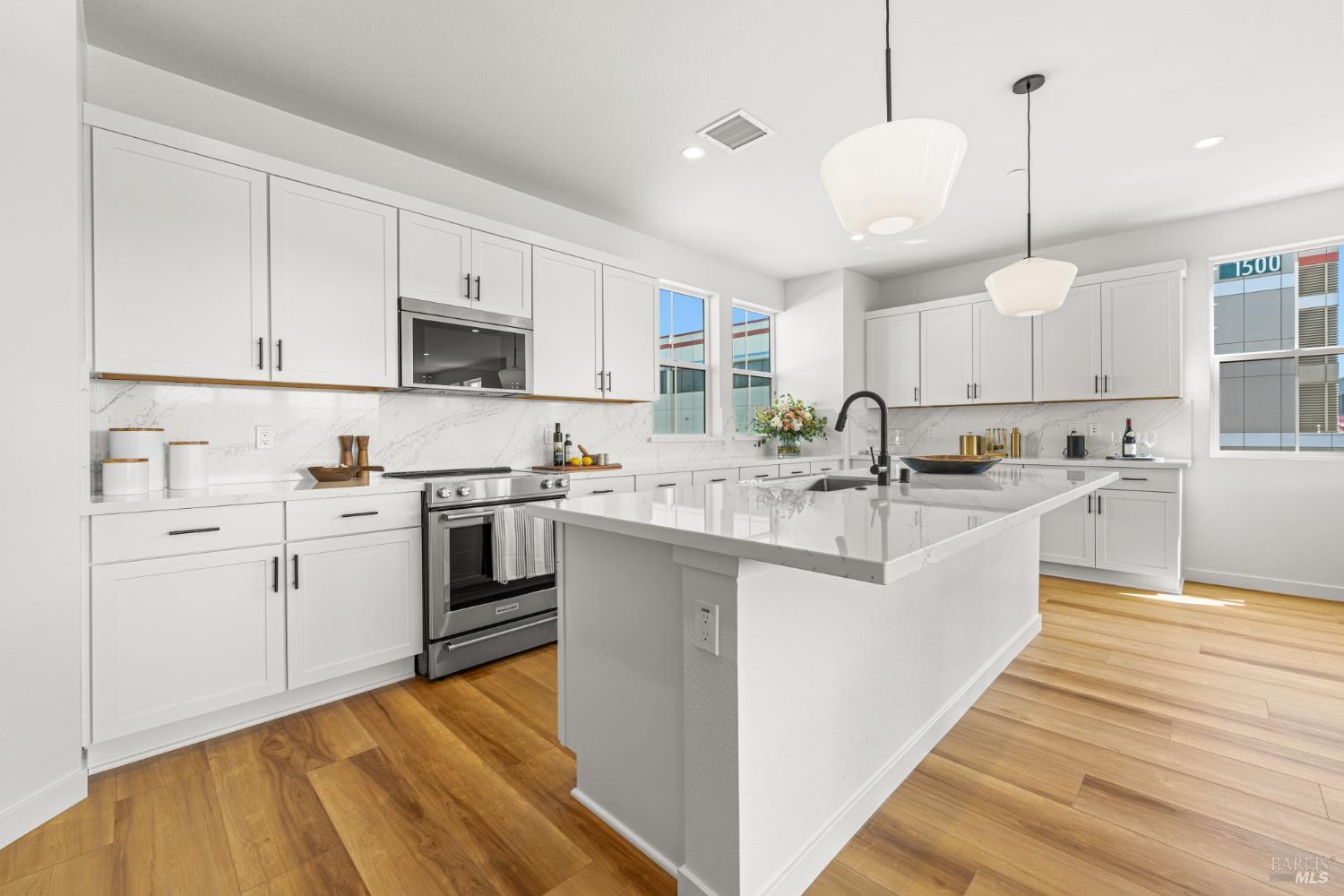 1480 Waterside Lane Rohnert Park, CA 94928 - Photo 9 of 35 a kitchen with kitchen island granite countertop a sink appliances cabinets and a counter top space