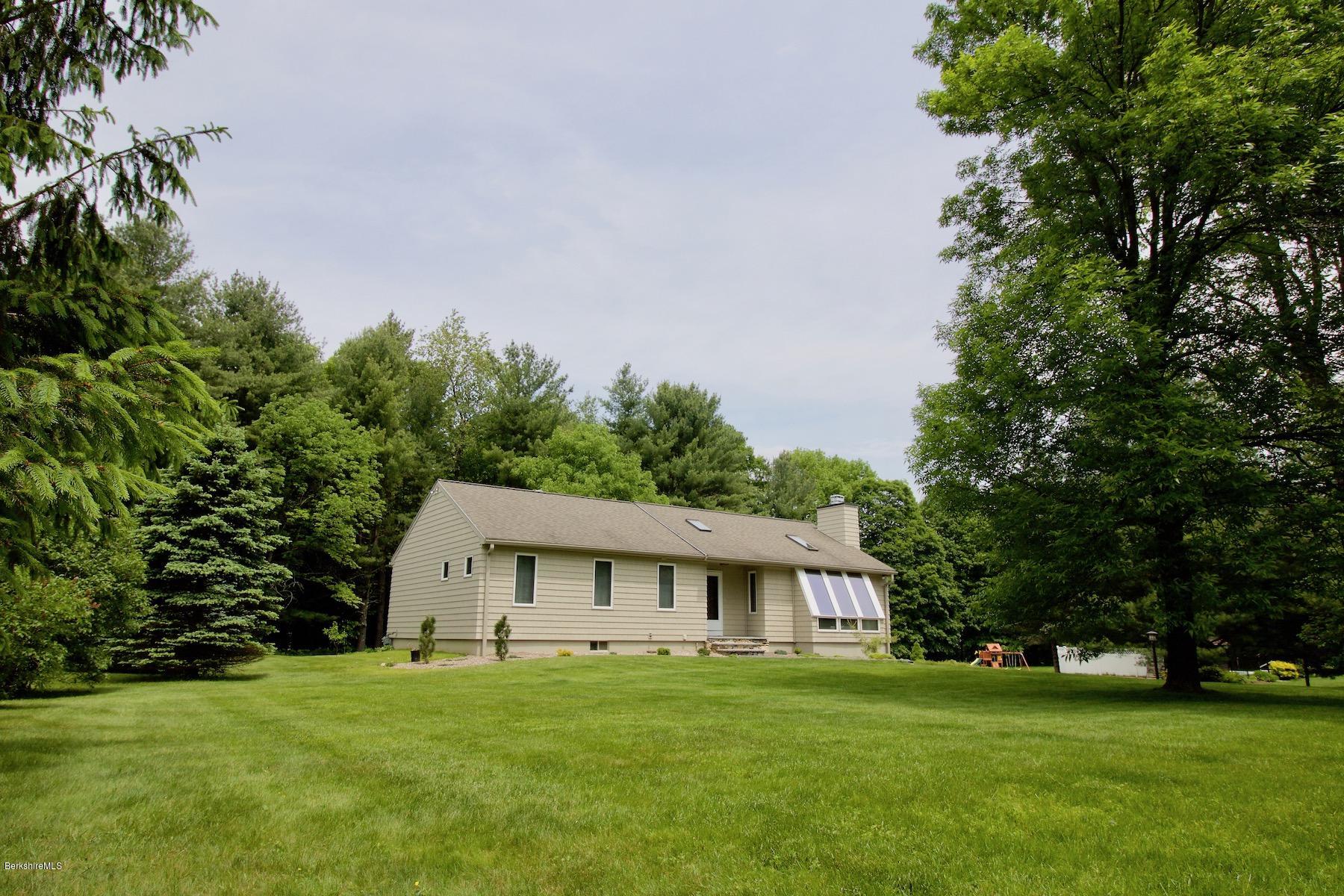 22 Old Barn Road Lenox, MA 01240 - Photo 1 of 37 a big house with a big yard and large trees