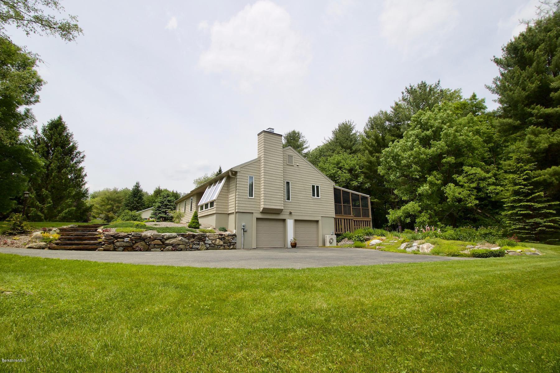 22 Old Barn Road Lenox, MA 01240 - Photo 11 of 37 a view of a house with a big yard and large trees
