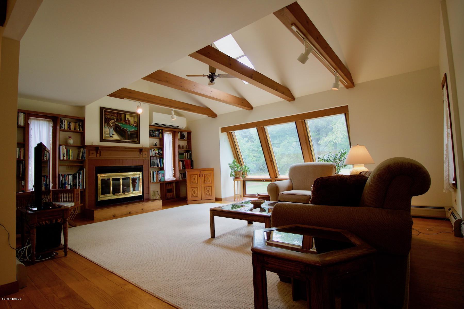 22 Old Barn Road Lenox, MA 01240 - Photo 16 of 37 a living room with fireplace furniture and a flat screen tv