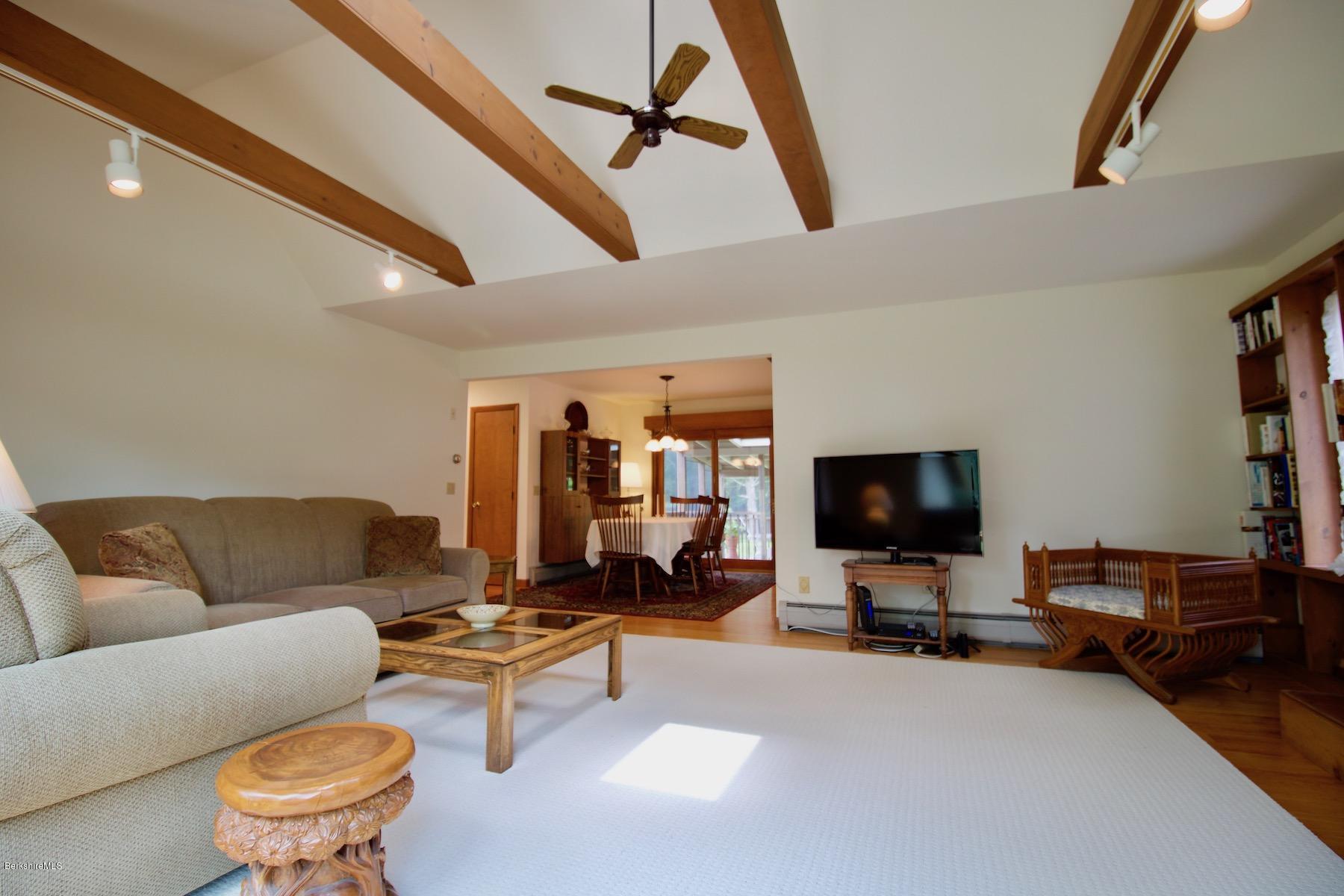 22 Old Barn Road Lenox, MA 01240 - Photo 17 of 37 a living room with furniture and a flat screen tv