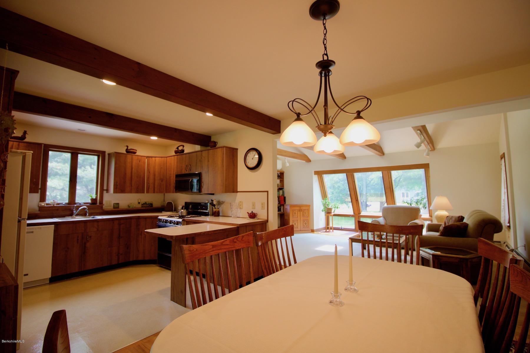 22 Old Barn Road Lenox, MA 01240 - Photo 22 of 37 a view of a dining room with furniture window and wooden floor