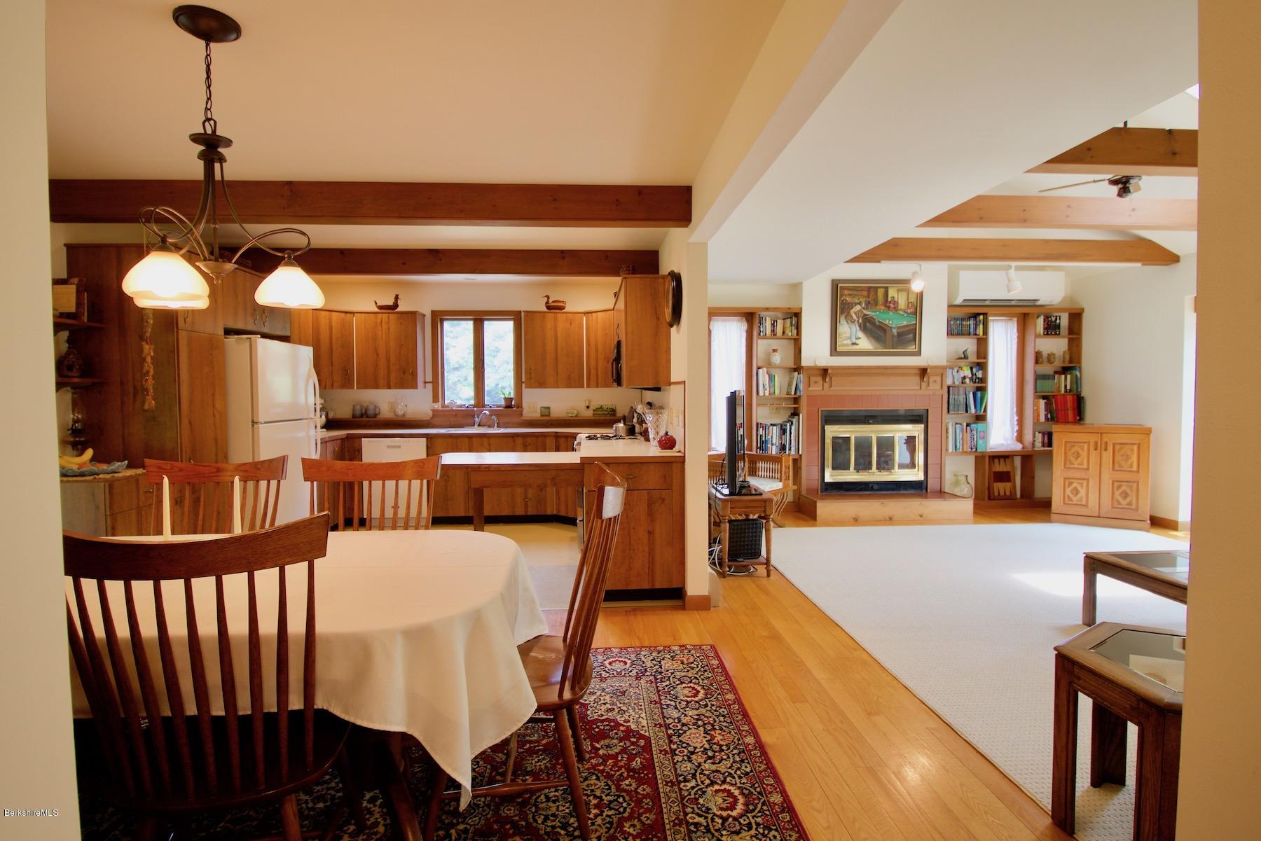 22 Old Barn Road Lenox, MA 01240 - Photo 23 of 37 a dining hall with furniture and a chandelier
