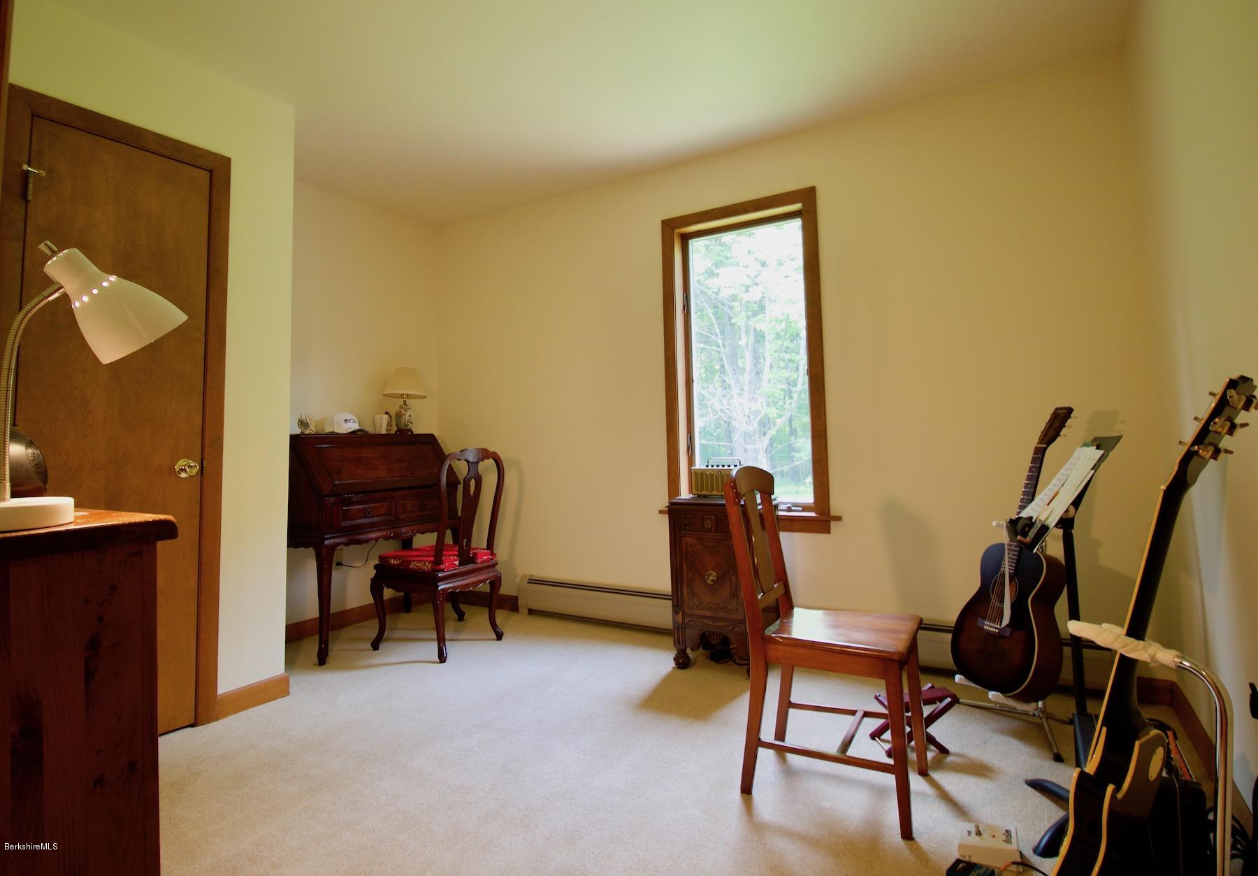 22 Old Barn Road Lenox, MA 01240 - Photo 27 of 37 a view of a workspace with furniture and a window