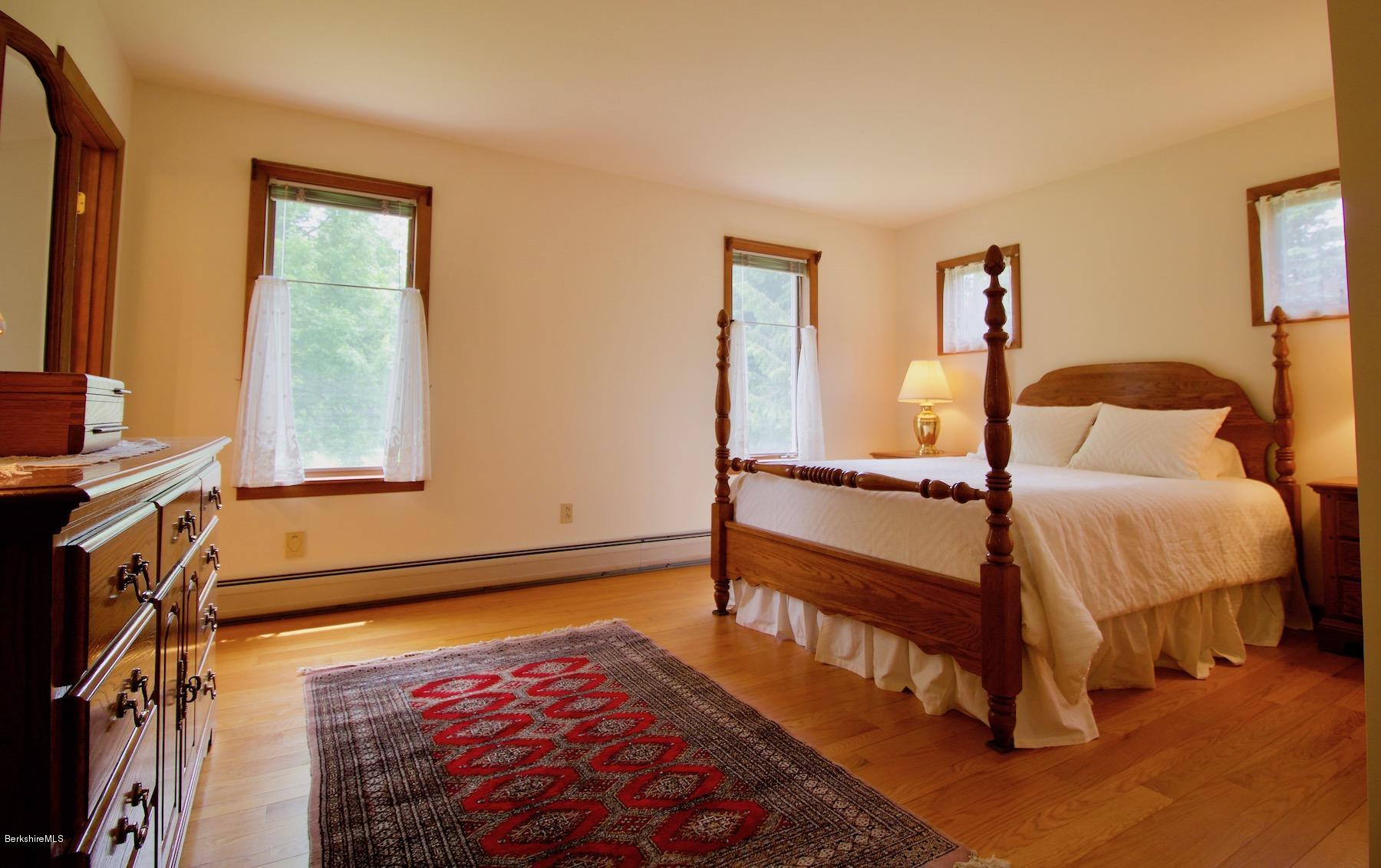 22 Old Barn Road Lenox, MA 01240 - Photo 28 of 37 a bedroom with a bed and a window