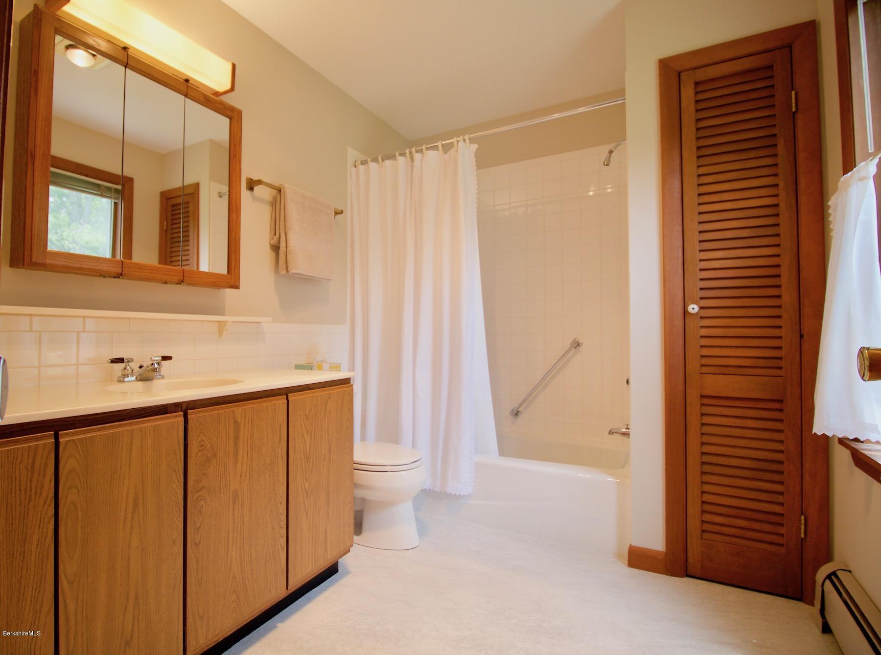 22 Old Barn Road Lenox, MA 01240 - Photo 31 of 37 a bathroom with a sink a toilet and shower