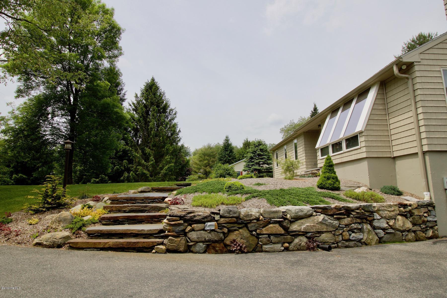 22 Old Barn Road Lenox, MA 01240 - Photo 8 of 37 a backyard of a house with lots of green space
