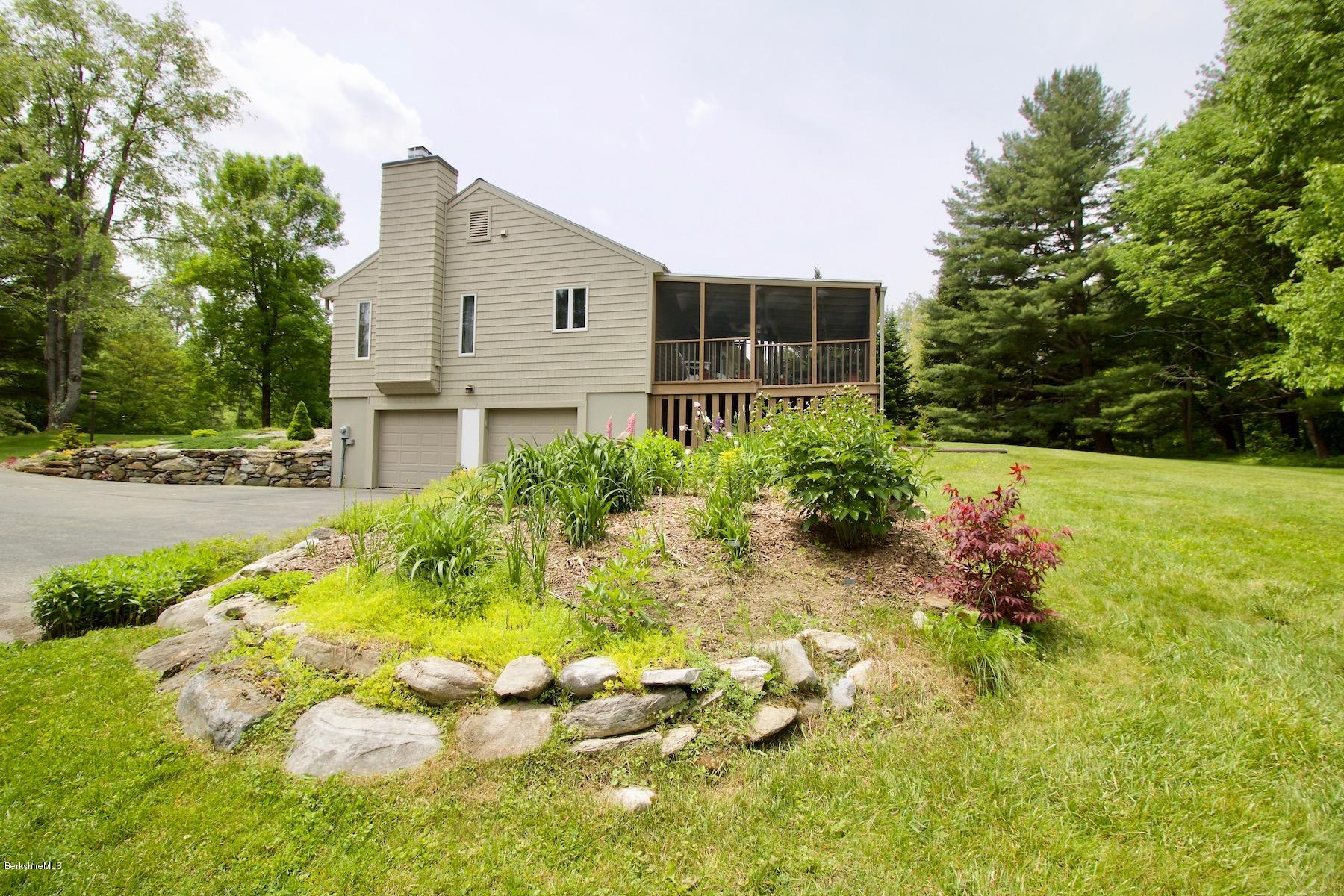 22 Old Barn Road Lenox, MA 01240 - Photo 9 of 37 a front view of a house with a yard