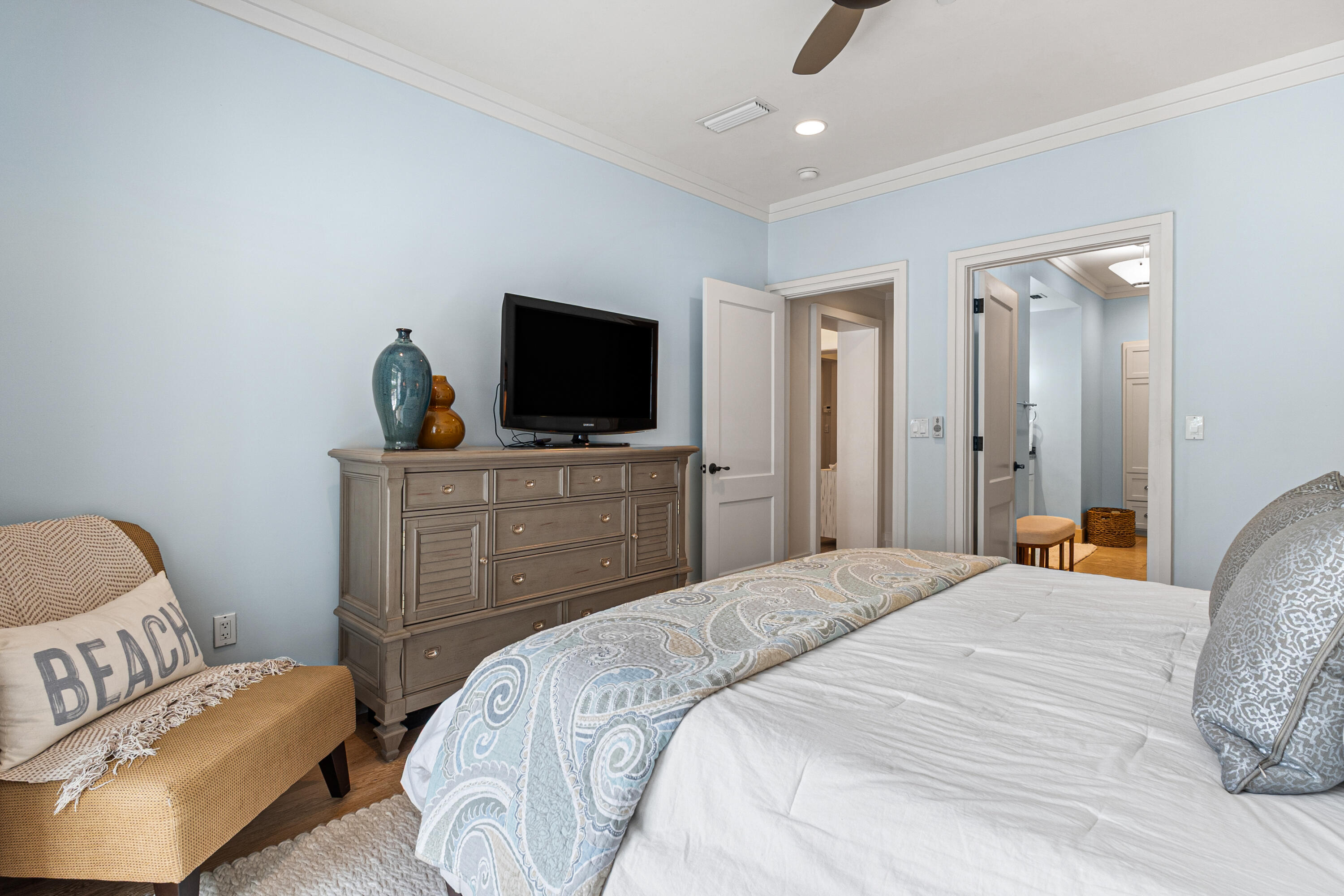 8377 East County Highway 30A, Unit 103 Inlet Beach, FL 32461 - Photo 21 of 36 a bedroom with a bed and a flat screen tv