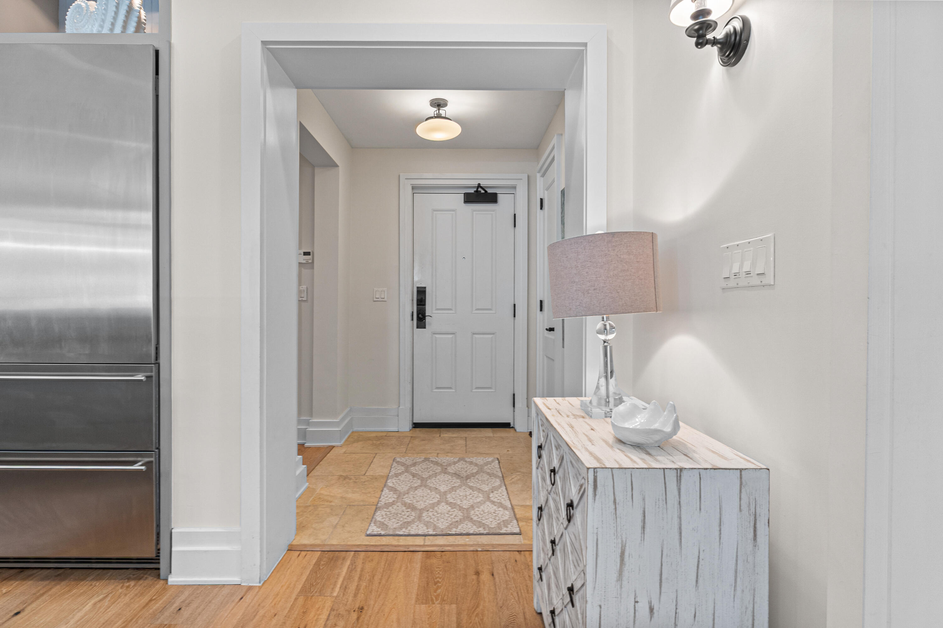 8377 East County Highway 30A, Unit 103 Inlet Beach, FL 32461 - Photo 3 of 36 a bedroom with a bed and wooden floor