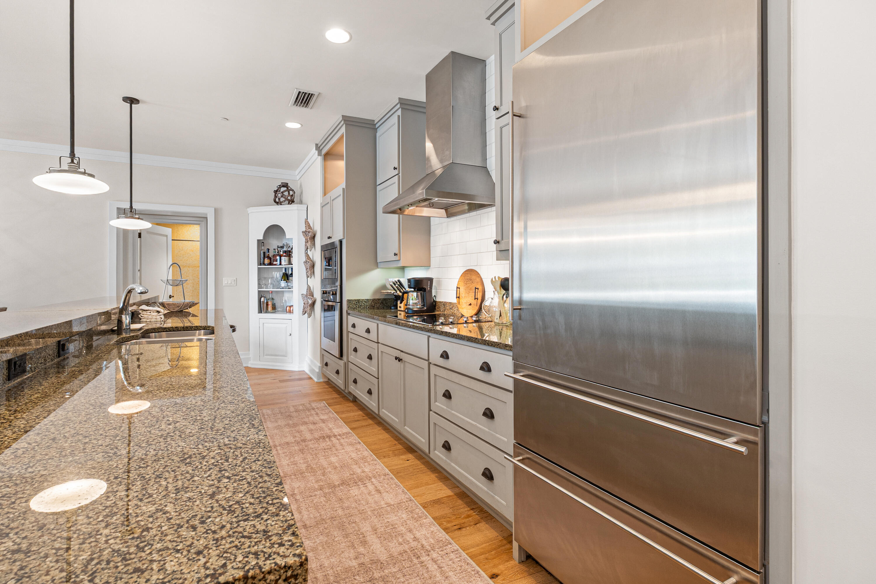 8377 East County Highway 30A, Unit 103 Inlet Beach, FL 32461 - Photo 8 of 36 a kitchen with stainless steel appliances granite countertop a refrigerator and a sink