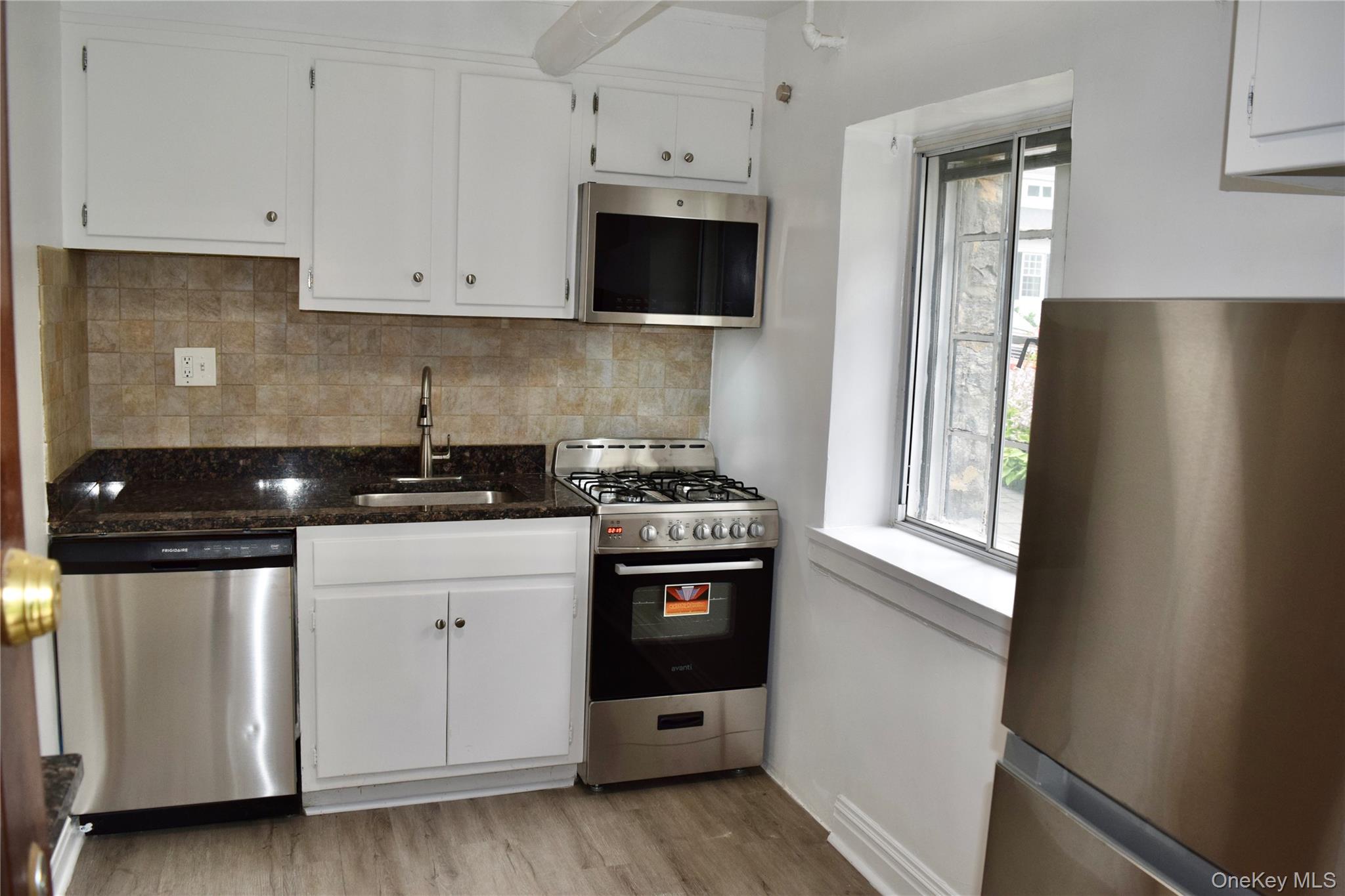 22 Sagamore Road, Unit A Bronxville, NY 10708 - Photo 3 of 13 Updated with new appliances and features exterior door leading to common garden area.