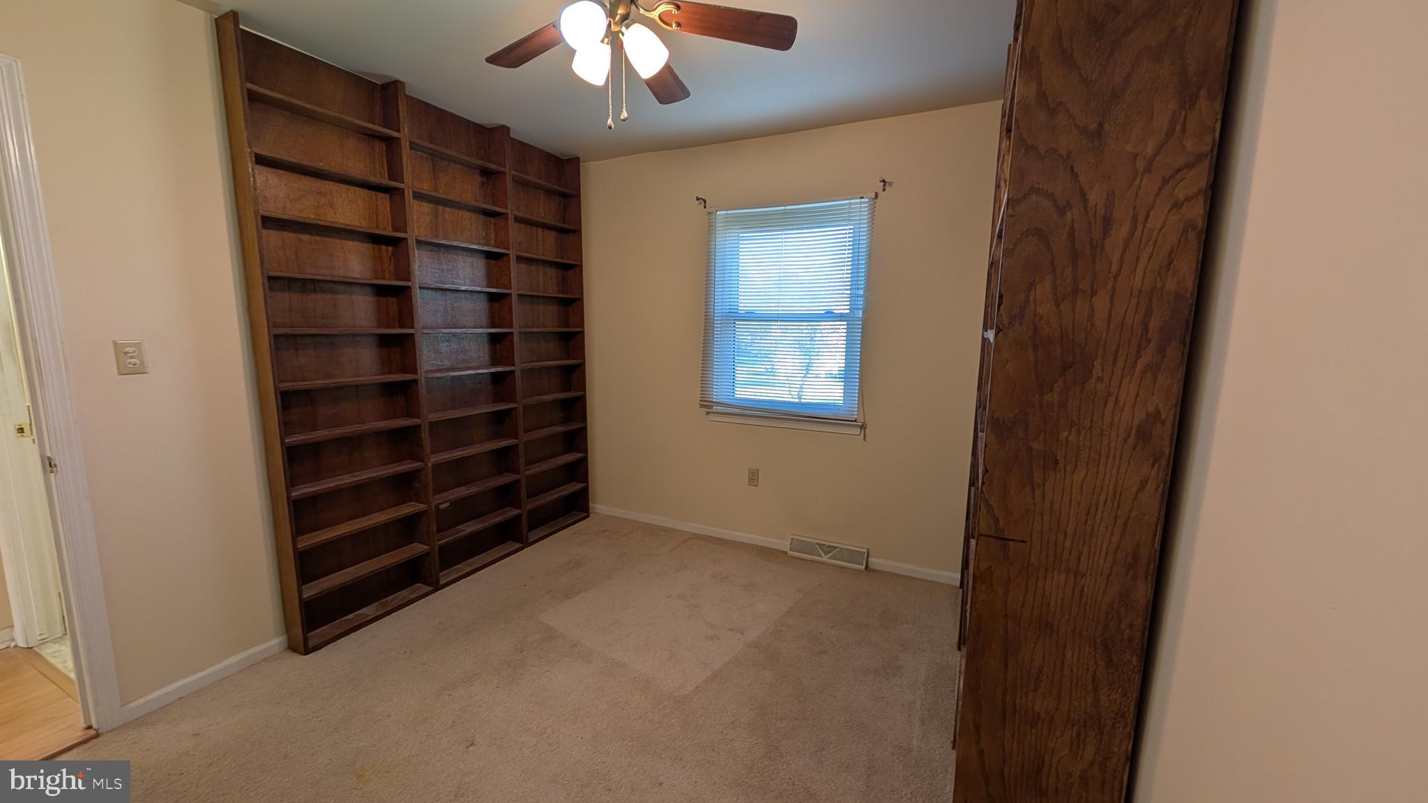 308 Spohn Road Reading, PA 19608 - Photo 13 of 25 a view of an empty room with a chandelier fan and fire place