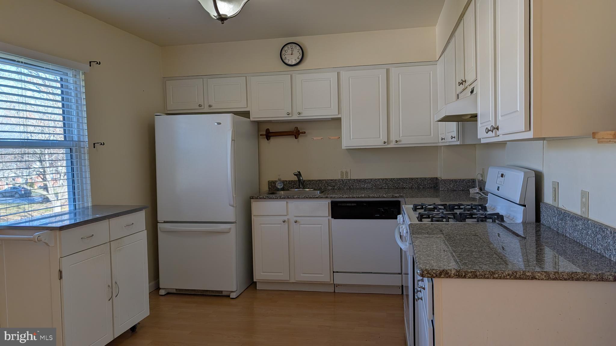 308 Spohn Road Reading, PA 19608 - Photo 7 of 25 a kitchen with a refrigerator sink and cabinets
