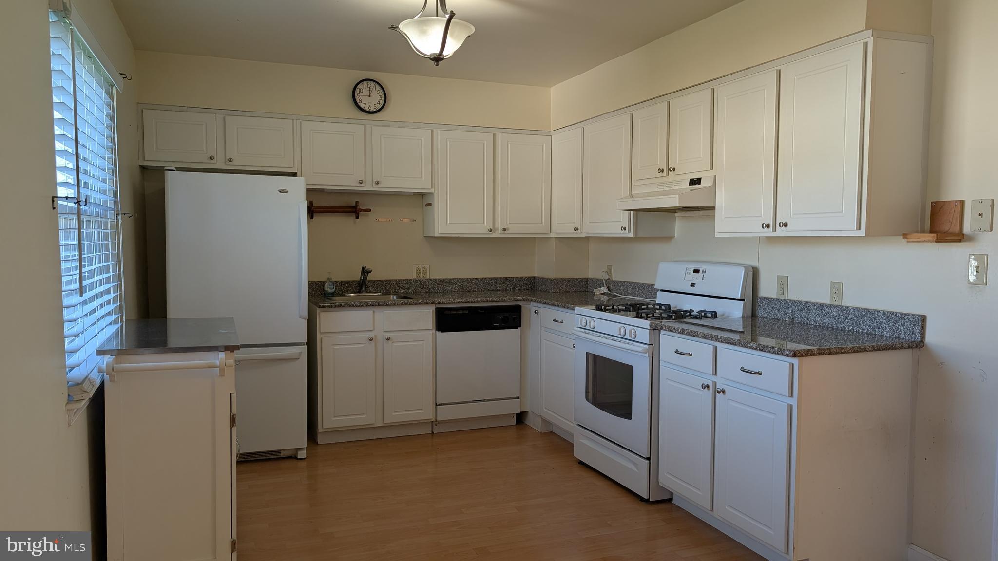 308 Spohn Road Reading, PA 19608 - Photo 8 of 25 a kitchen with white cabinets and white appliances