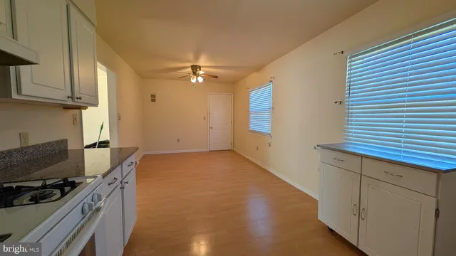 a kitchen with a stove and a kitchen view