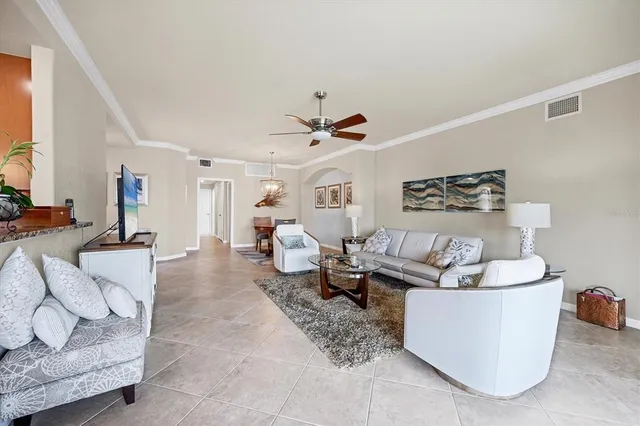 a kitchen with stainless steel appliances granite countertop a refrigerator stove a sink and dishwasher a oven with wooden cabinets