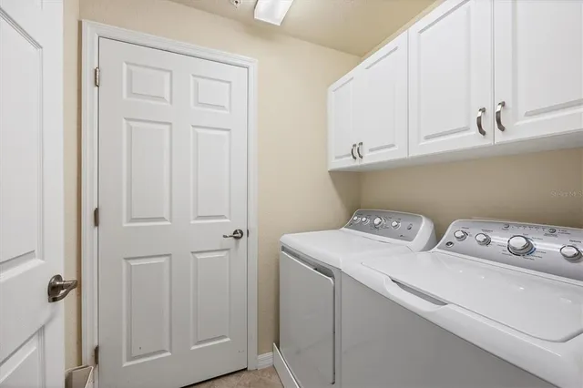 an aerial view of a house with garden space and street view
