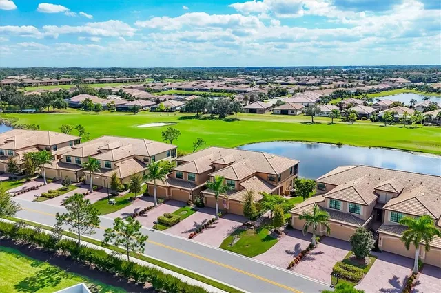 an aerial view of a house with garden space and street view