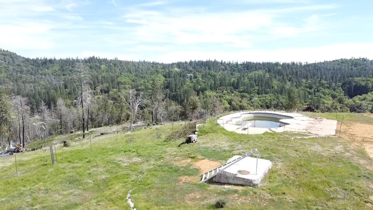 1720 River View Lane Colfax, CA 95713 - Photo 2 of 32 a swimming pool with trees in the background