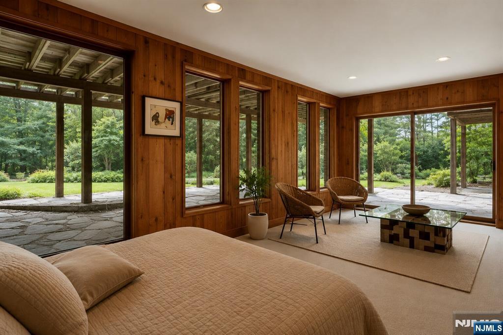 34 Cambridge Way Alpine, NJ 07620 - Photo 31 of 48 a bedroom with furniture and large windows