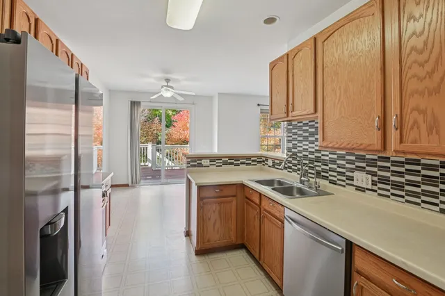 a kitchen with a sink stove and refrigerator