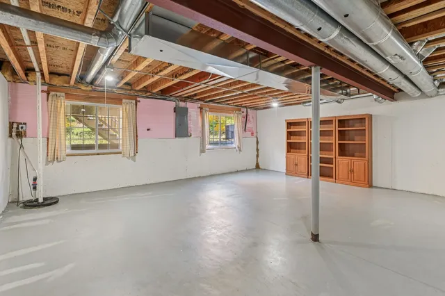 a view of a room with wooden walls
