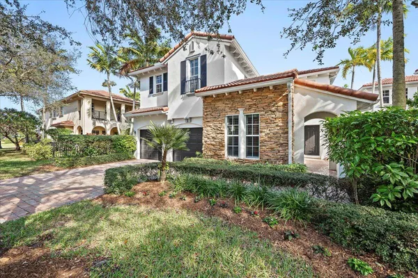 a view of a hallway with wooden walls and door
