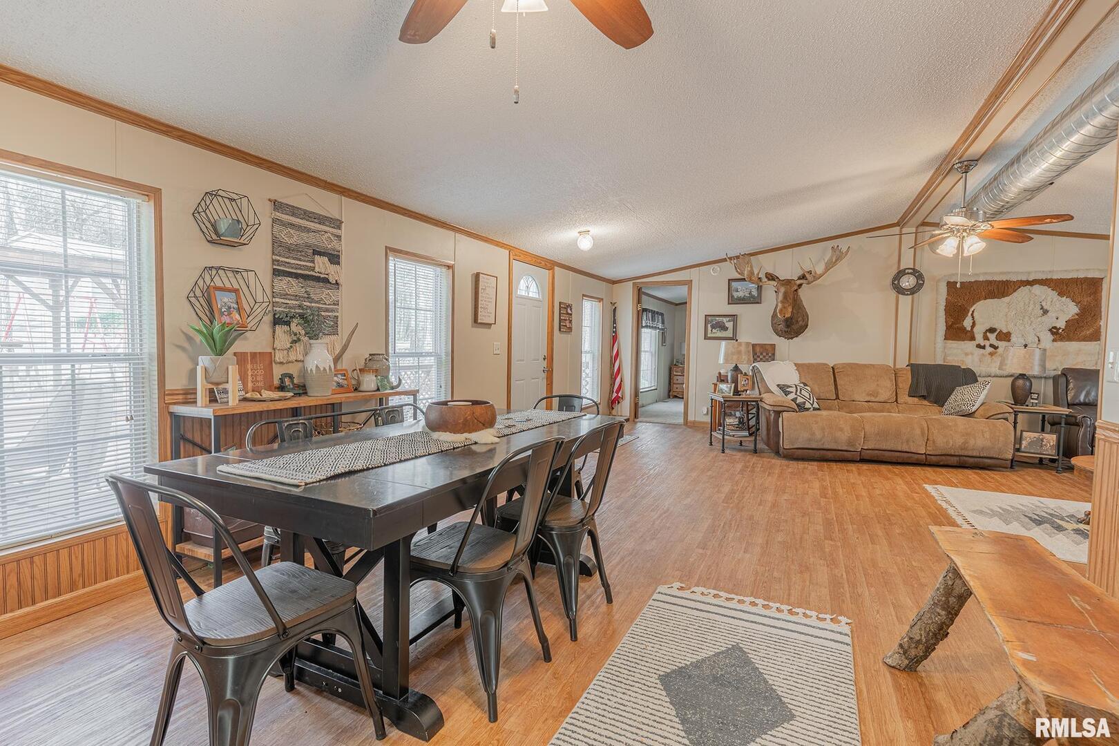 565 Dutton Chapel Road Herod, IL 62947 - Photo 49 of 54 a view of a dining room and livingroom with furniture wooden floor and a rug