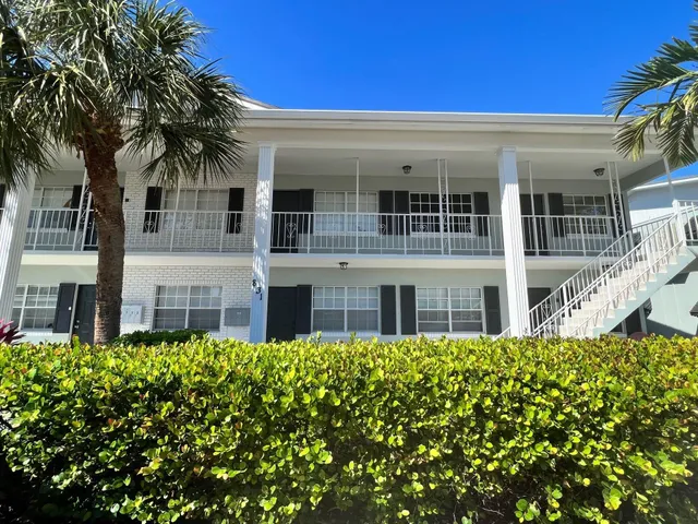 front view of a house with a small yard