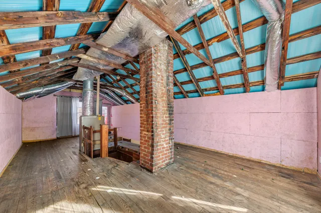 a view of a room with wooden walls