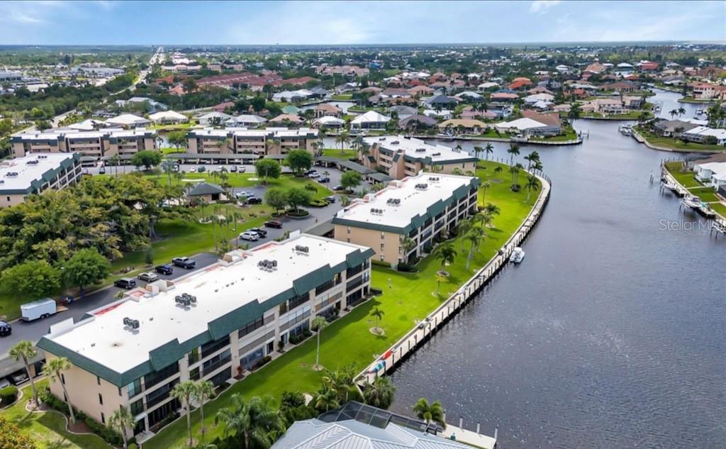 601 Shreve Street, Unit 15B Punta Gorda, FL 33950 - Photo 1 of 29 an aerial view of a house with a swimming pool yard and mountain view in back