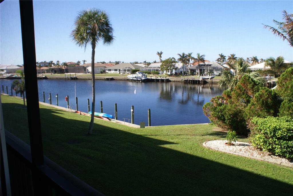 601 Shreve Street, Unit 15B Punta Gorda, FL 33950 - Photo 13 of 29 a view of a lake with palm trees