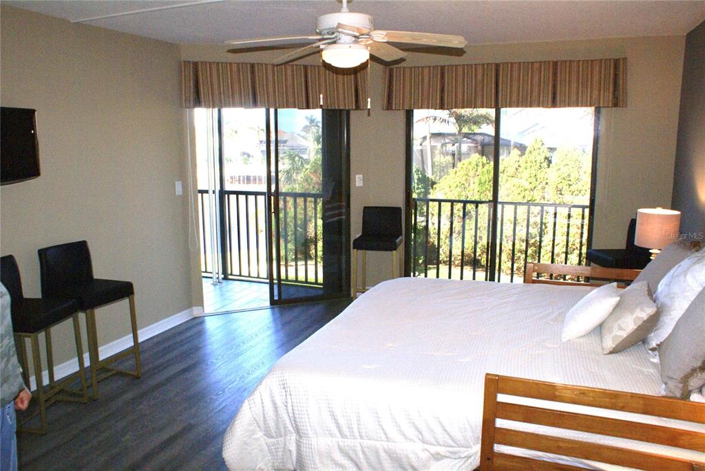 601 Shreve Street, Unit 15B Punta Gorda, FL 33950 - Photo 16 of 29 a bedroom with a bed and a large window