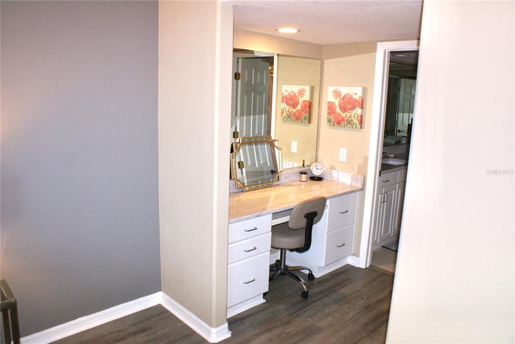 601 Shreve Street, Unit 15B Punta Gorda, FL 33950 - Photo 17 of 29 a bathroom with a sink a toilet a mirror and a window
