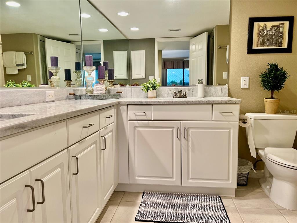 601 Shreve Street, Unit 15B Punta Gorda, FL 33950 - Photo 18 of 29 a spacious bathroom with a sink a toilet and a mirror