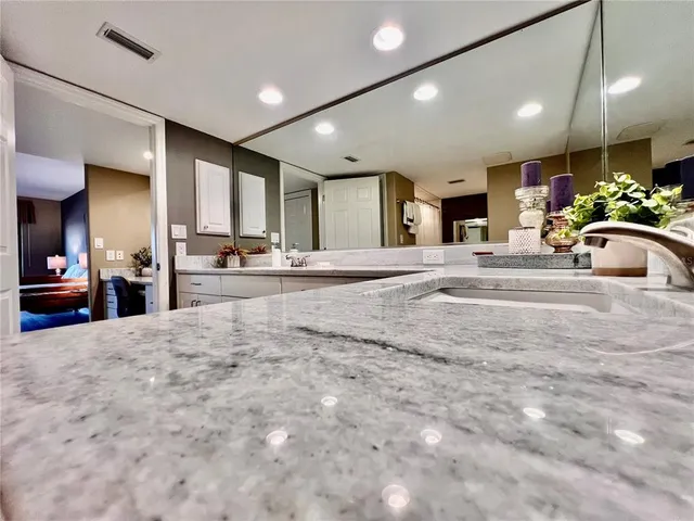 a view of a bedroom with wooden floor and front door