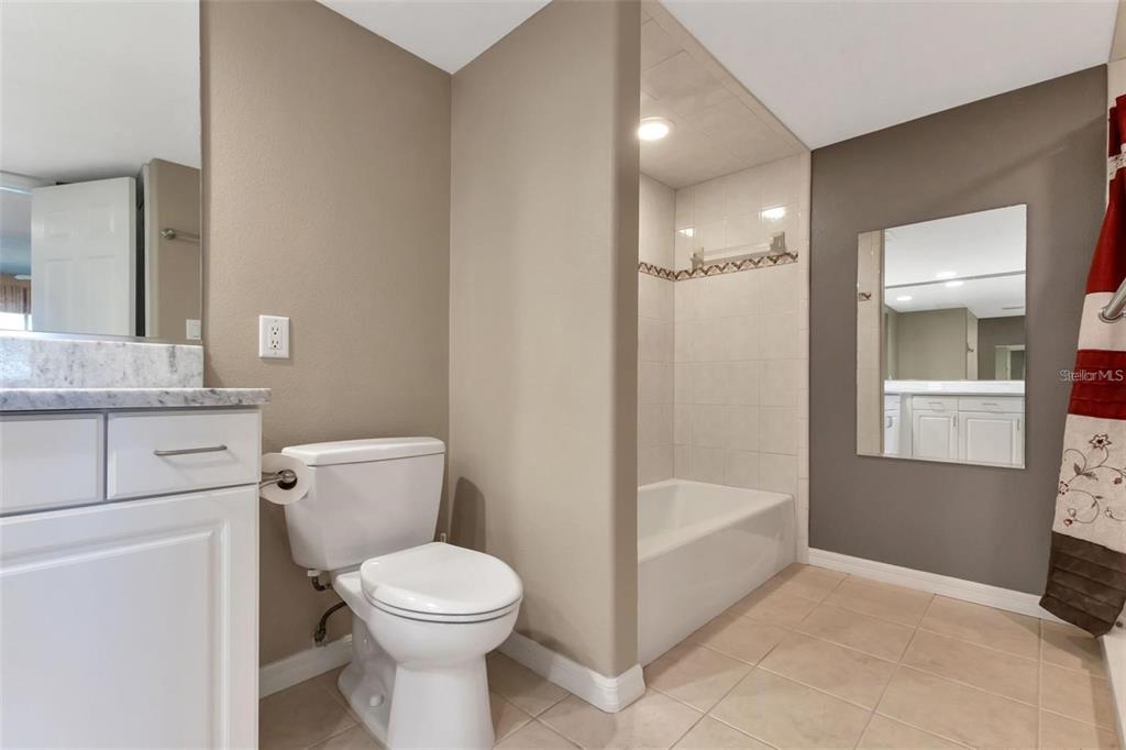 601 Shreve Street, Unit 15B Punta Gorda, FL 33950 - Photo 20 of 29 a bathroom with a toilet sink and shower