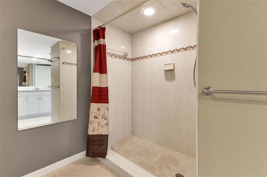 601 Shreve Street, Unit 15B Punta Gorda, FL 33950 - Photo 22 of 29 a bathroom with a shower and a mirror