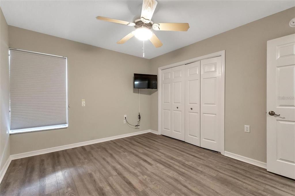 601 Shreve Street, Unit 15B Punta Gorda, FL 33950 - Photo 23 of 29 wooden floor in an empty room with a window