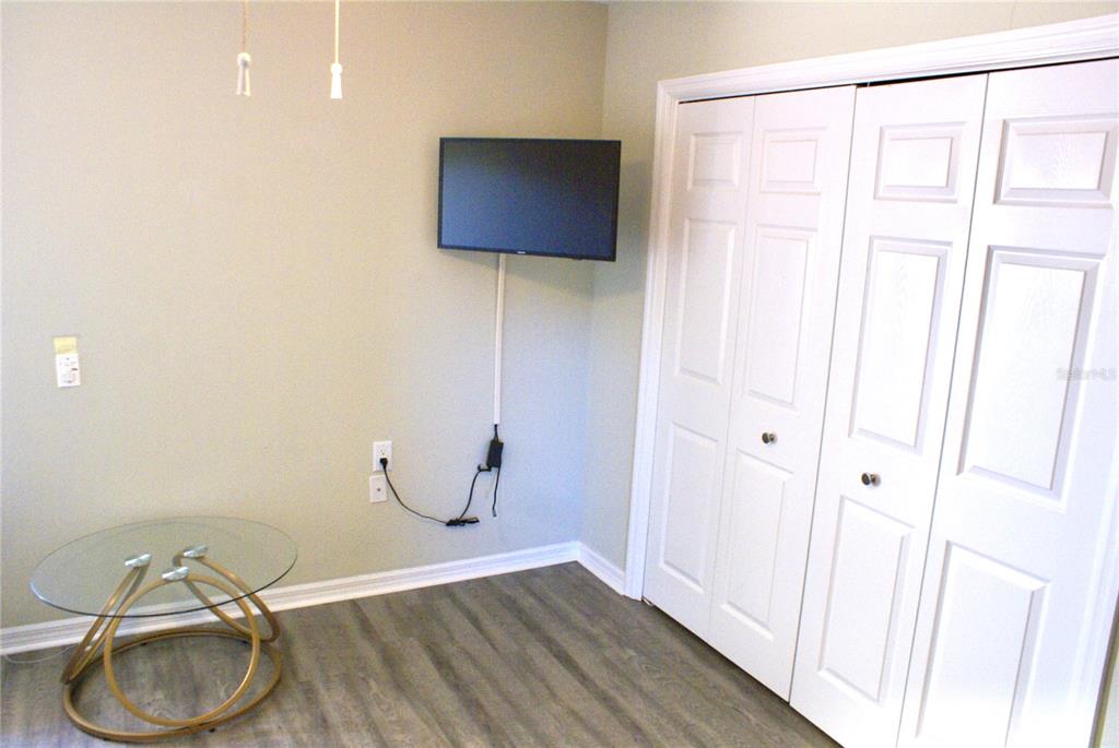 601 Shreve Street, Unit 15B Punta Gorda, FL 33950 - Photo 24 of 29 a room with wooden floor and a chair