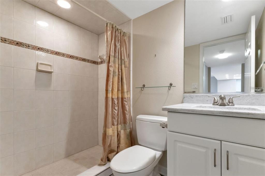 601 Shreve Street, Unit 15B Punta Gorda, FL 33950 - Photo 26 of 29 a bathroom with a sink a toilet and shower