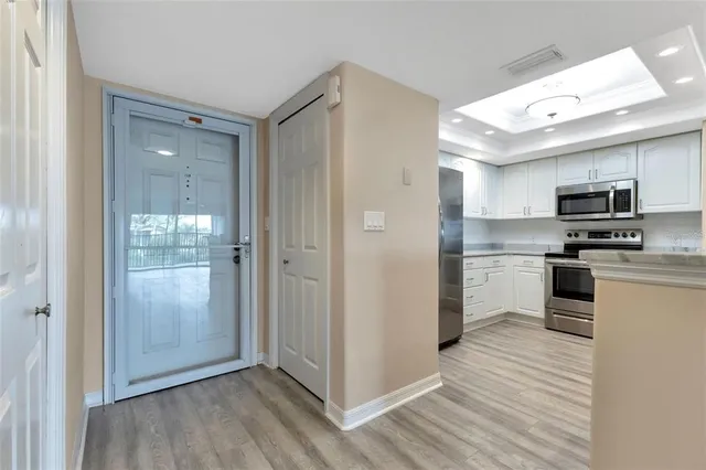 a open kitchen with a sink and stainless steel appliances