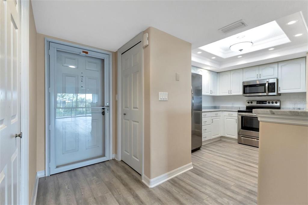 601 Shreve Street, Unit 15B Punta Gorda, FL 33950 - Photo 3 of 29 a open kitchen with a sink and stainless steel appliances