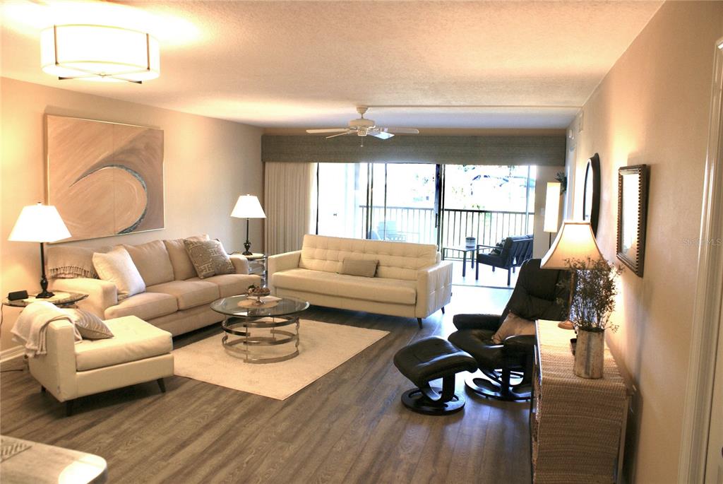 601 Shreve Street, Unit 15B Punta Gorda, FL 33950 - Photo 5 of 29 a living room with furniture and wooden floor